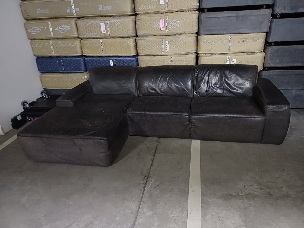 L SHAPED COUCH TORN  X1