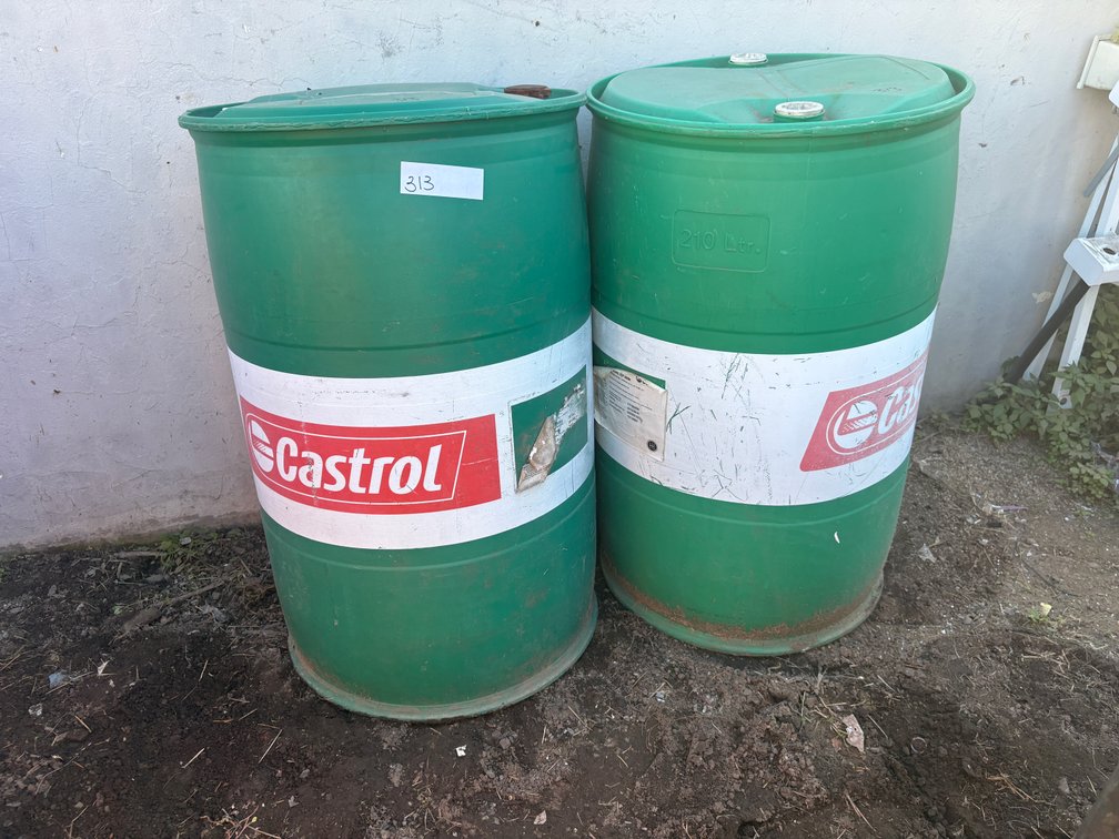 Two Castrol Drums and Four Round Refuse Bins