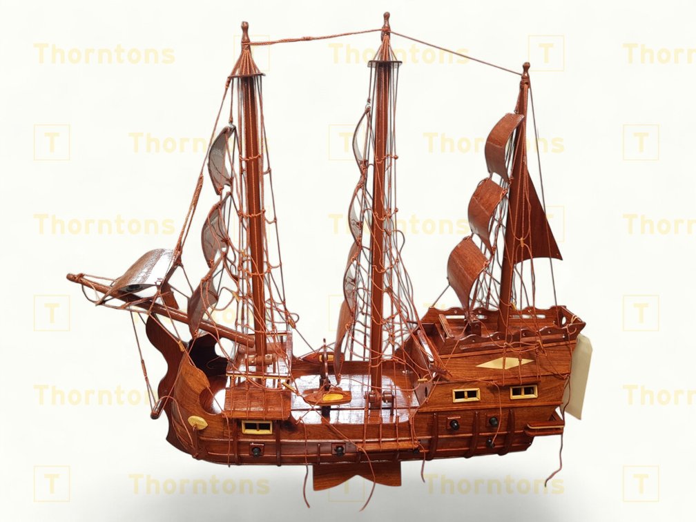 Handcrafted Wooden Model Ship with Detailed Rigging and Sails
