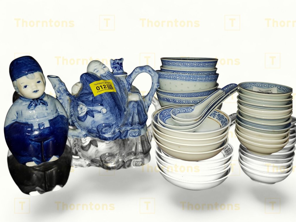 Blue and White Ceramic Collection Including Teapot, Figurine, Bowls, and Spoons