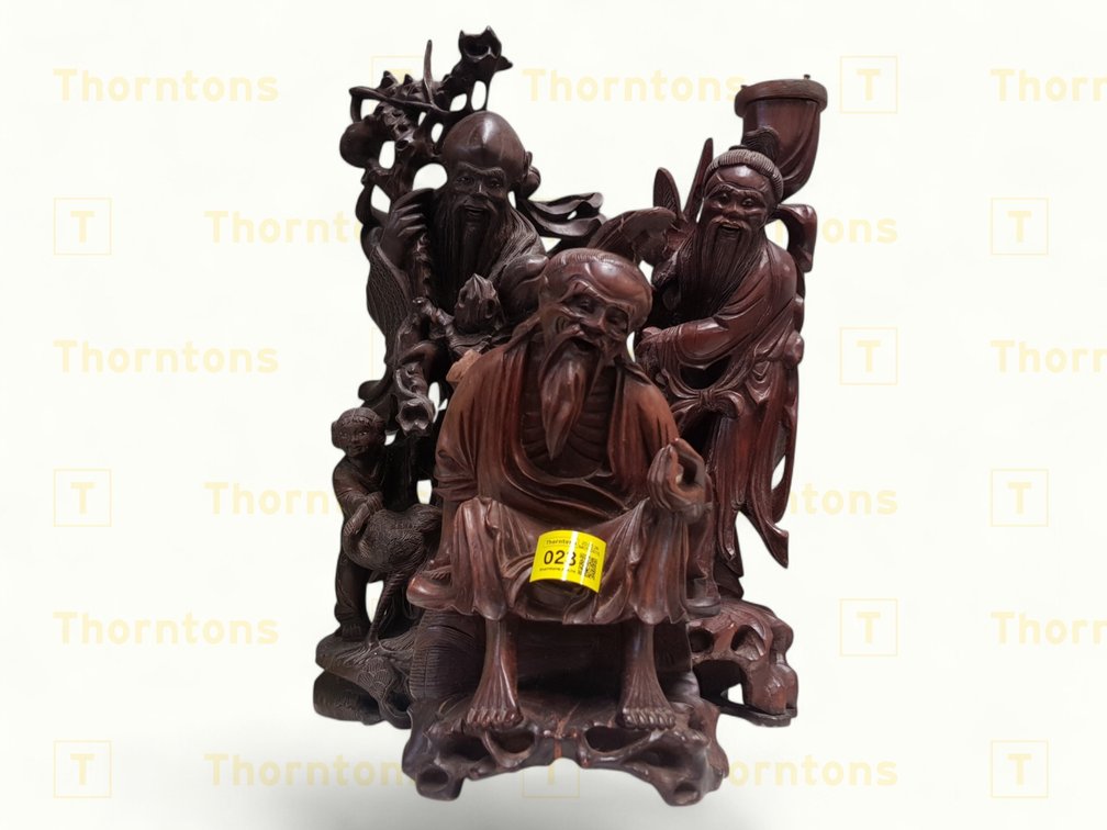Three Carved Wooden Figurines Depicting Scholars and Attendants