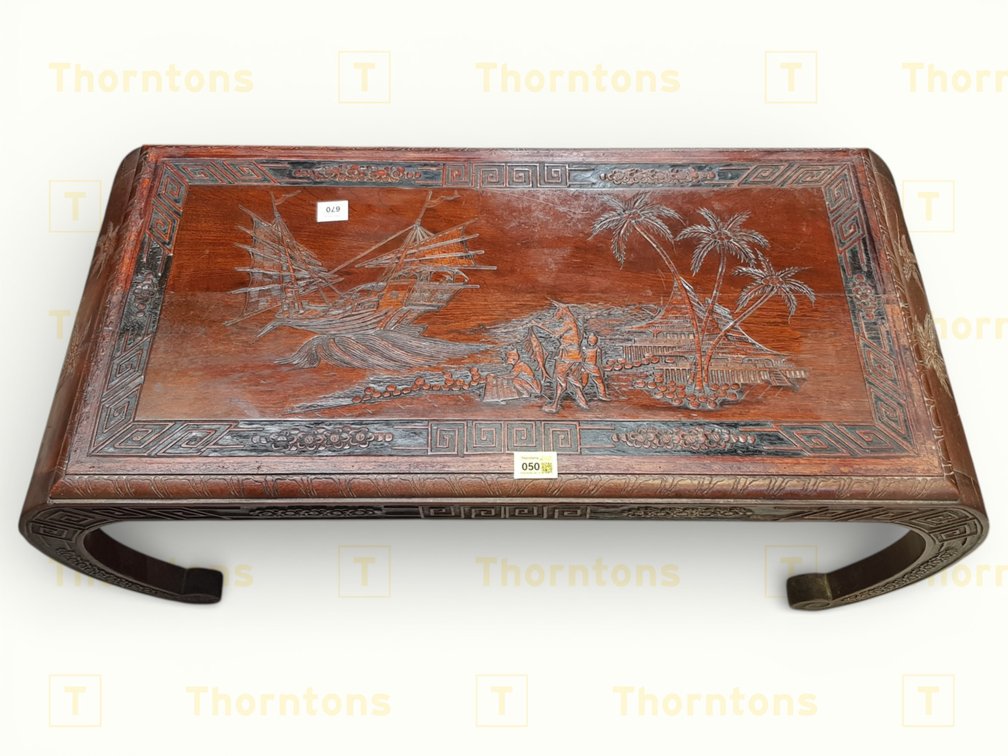 Handcrafted Wooden Coffee Table with Ornate Carved Scene and Curved Legs