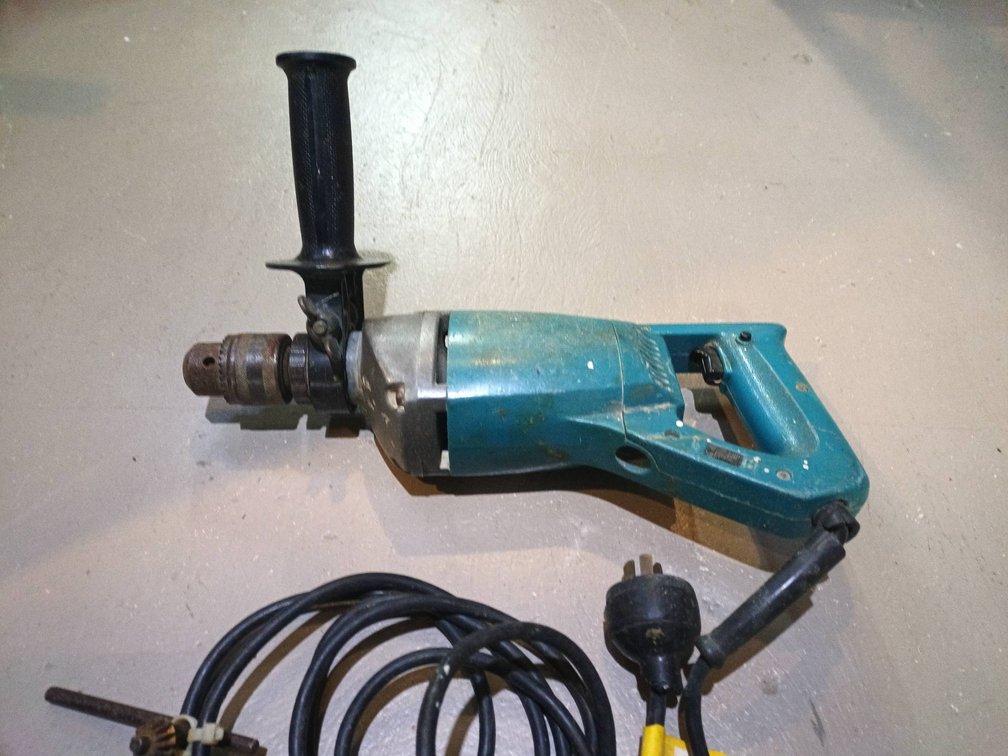 Makita Electric Drill with Side Handle