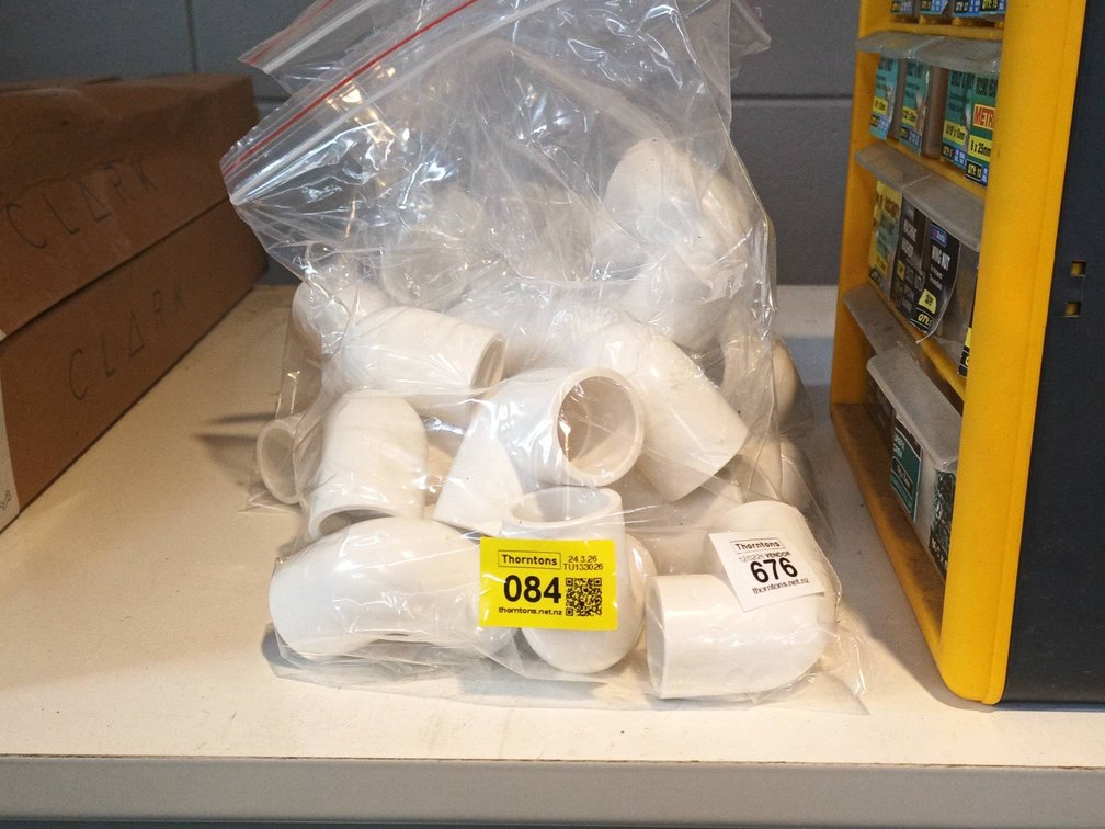 Bag of White PVC Pipe Fittings